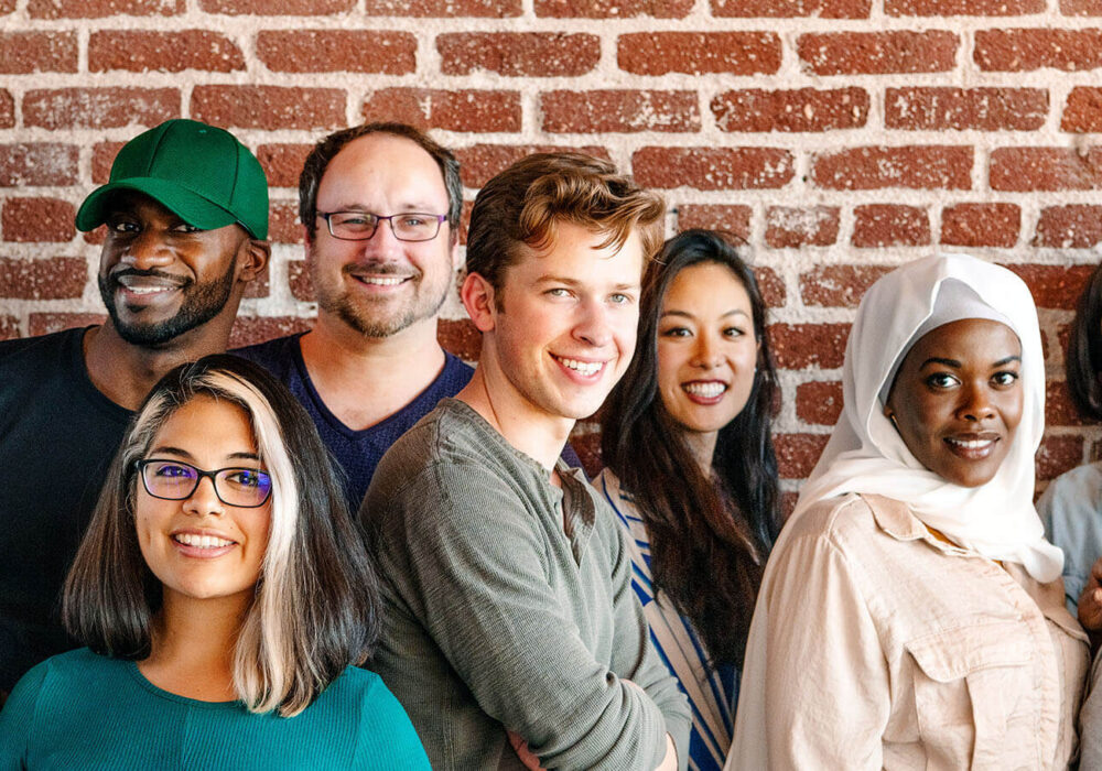 Group of people looking at the camera and smiling