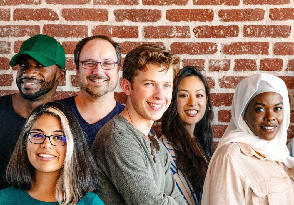 Group of people looking at the camera and smiling