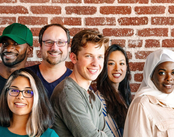 Group of people looking at the camera and smiling